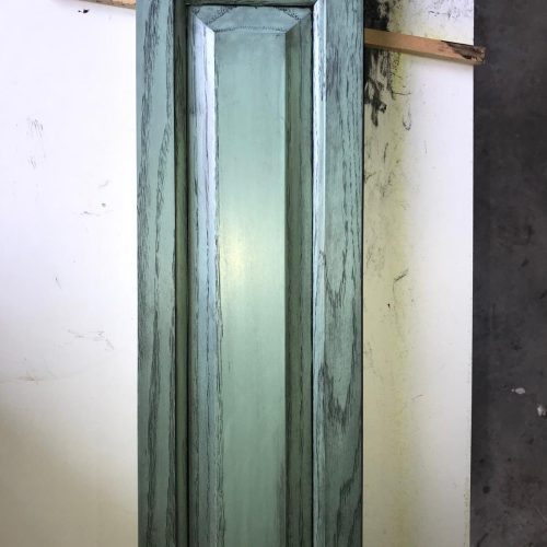 Close-up of the unique green glazed white oak finish